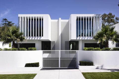 Designing outdoor spaces with modern black ceiling fans and integrated lighting